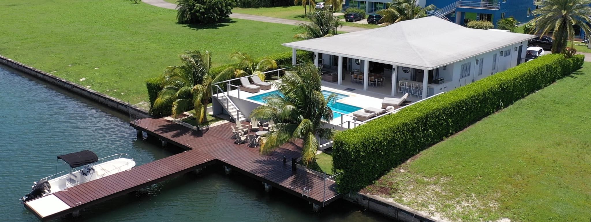 Aerial view of Coco Palms villa, pool and private dock