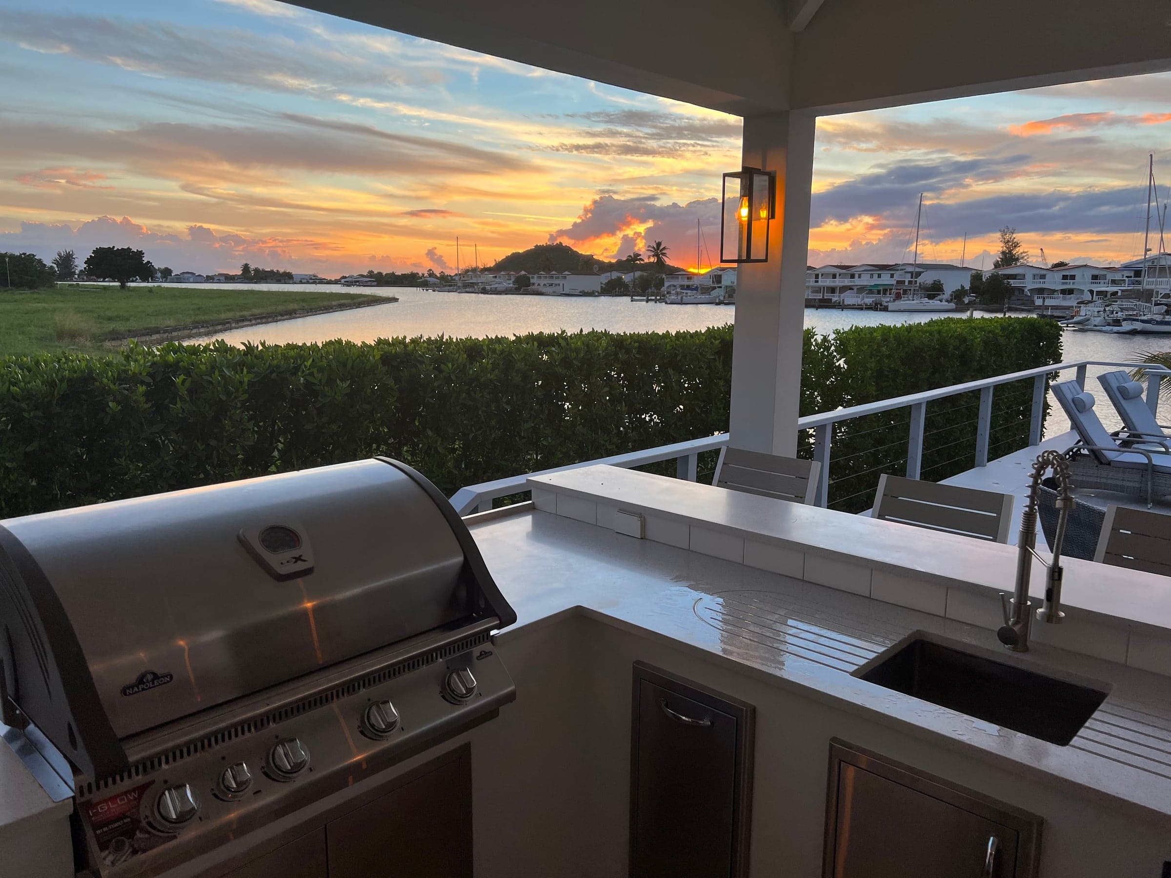 Outdoor kitchen overlooking the harbour at sunset