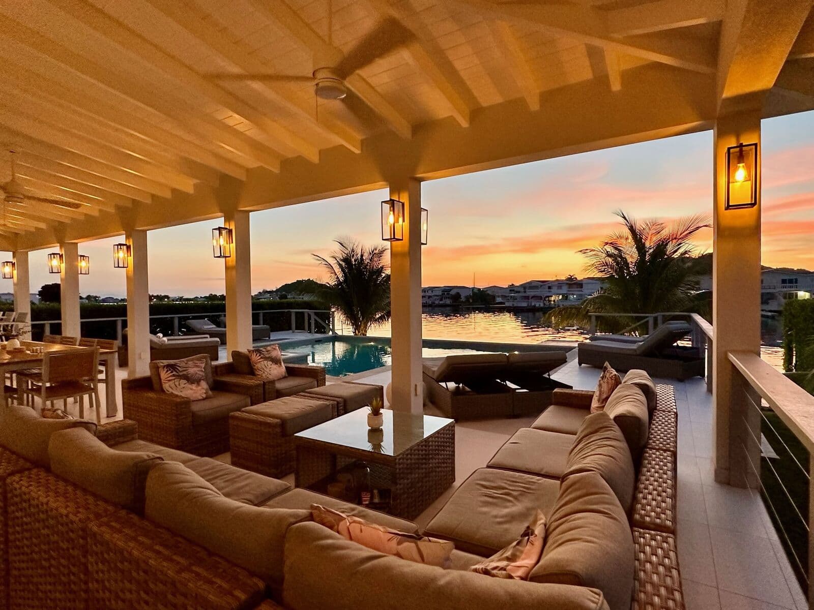 Covered terrace with sunset views across the harbour