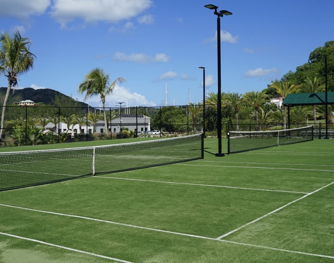 Floodlit tennis courts at Jolly Harbour Sports Village