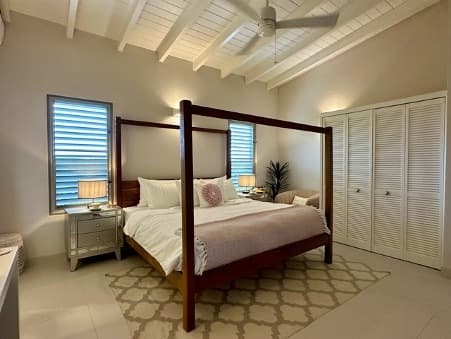 Coco Palms bedroom with a four-poster bed